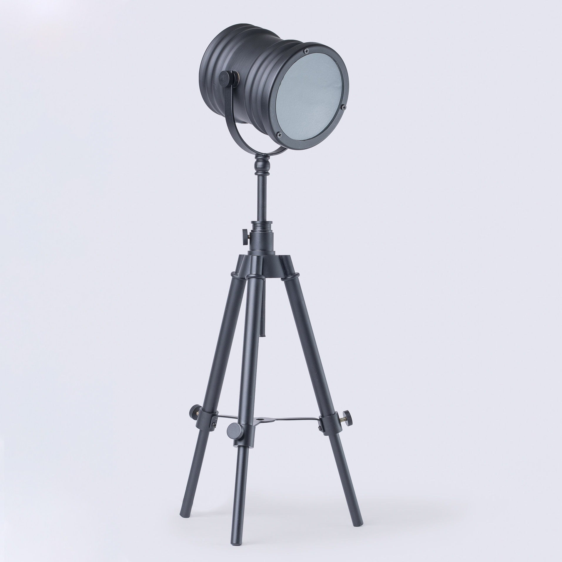 Product Photography of a black desk lamp. It has a gray background.